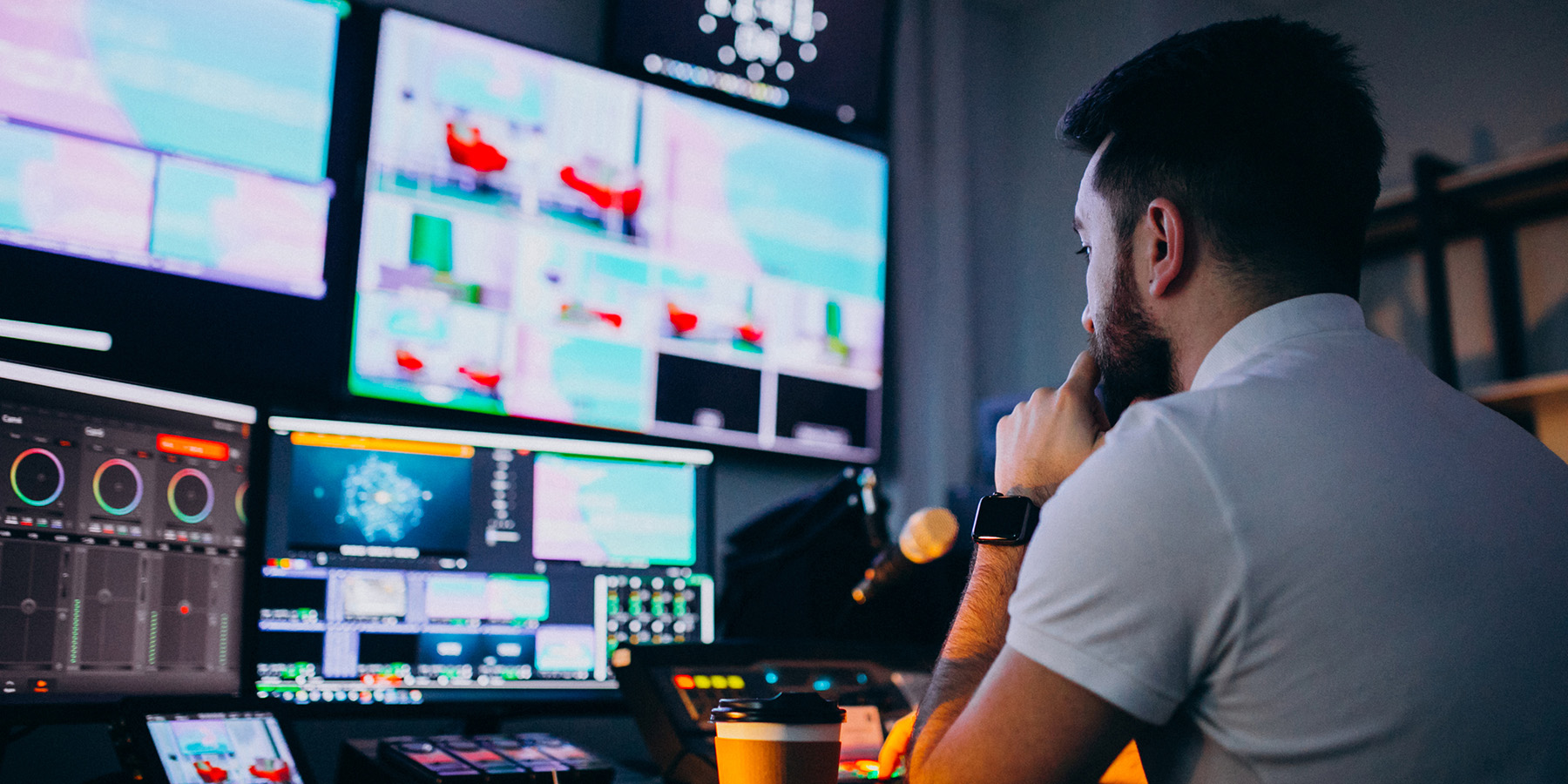 Man producing music in a professional recording studio with AV technology